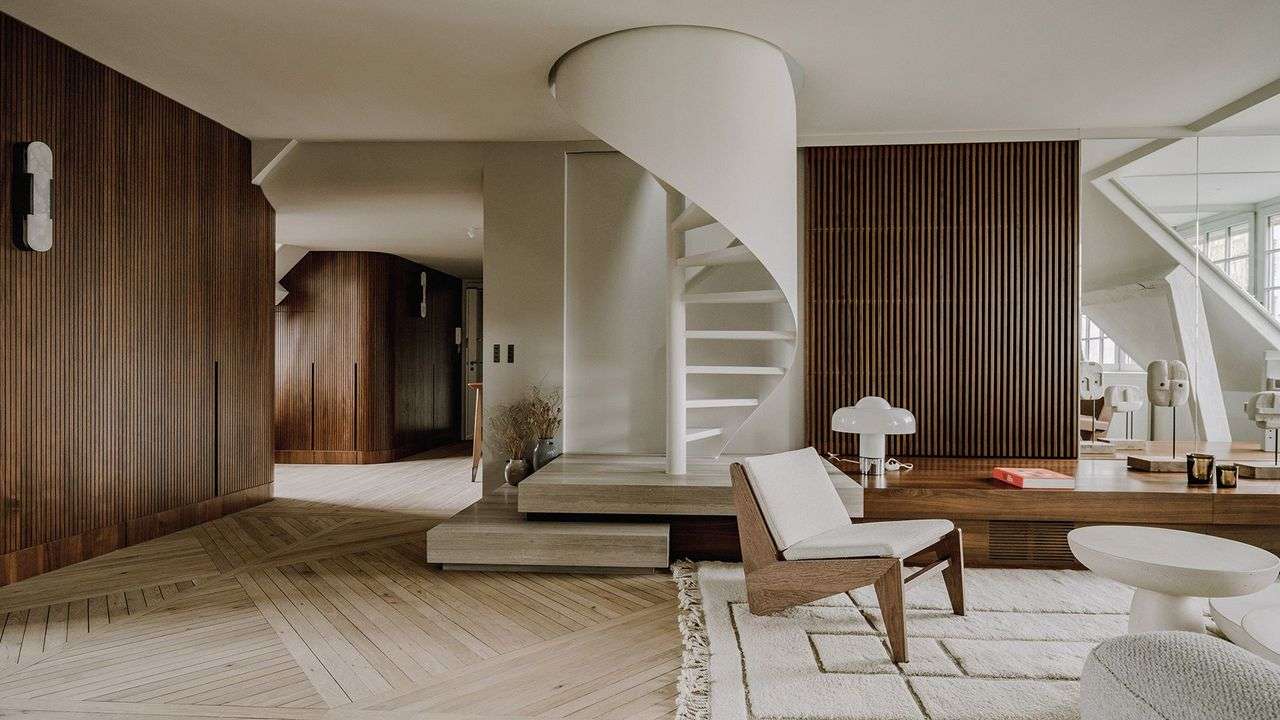 Luxury apartment interior with circular staircase and modern living area, albania luxury real estate